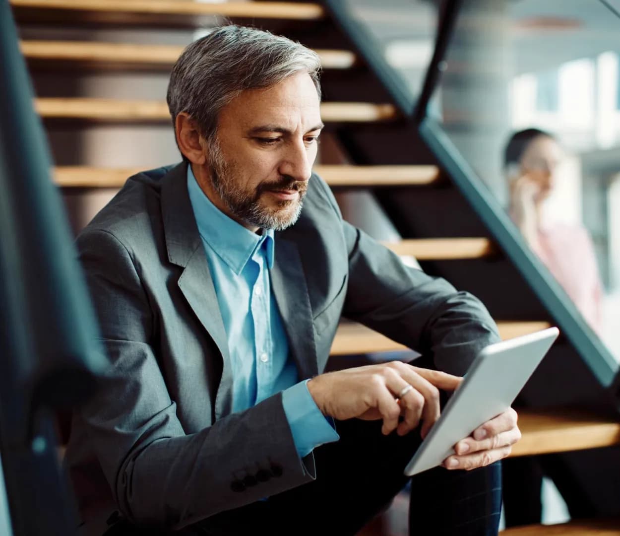 Consultant reviewing store performance on a tablet