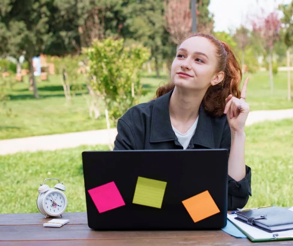 Student working on a laptop outdoors